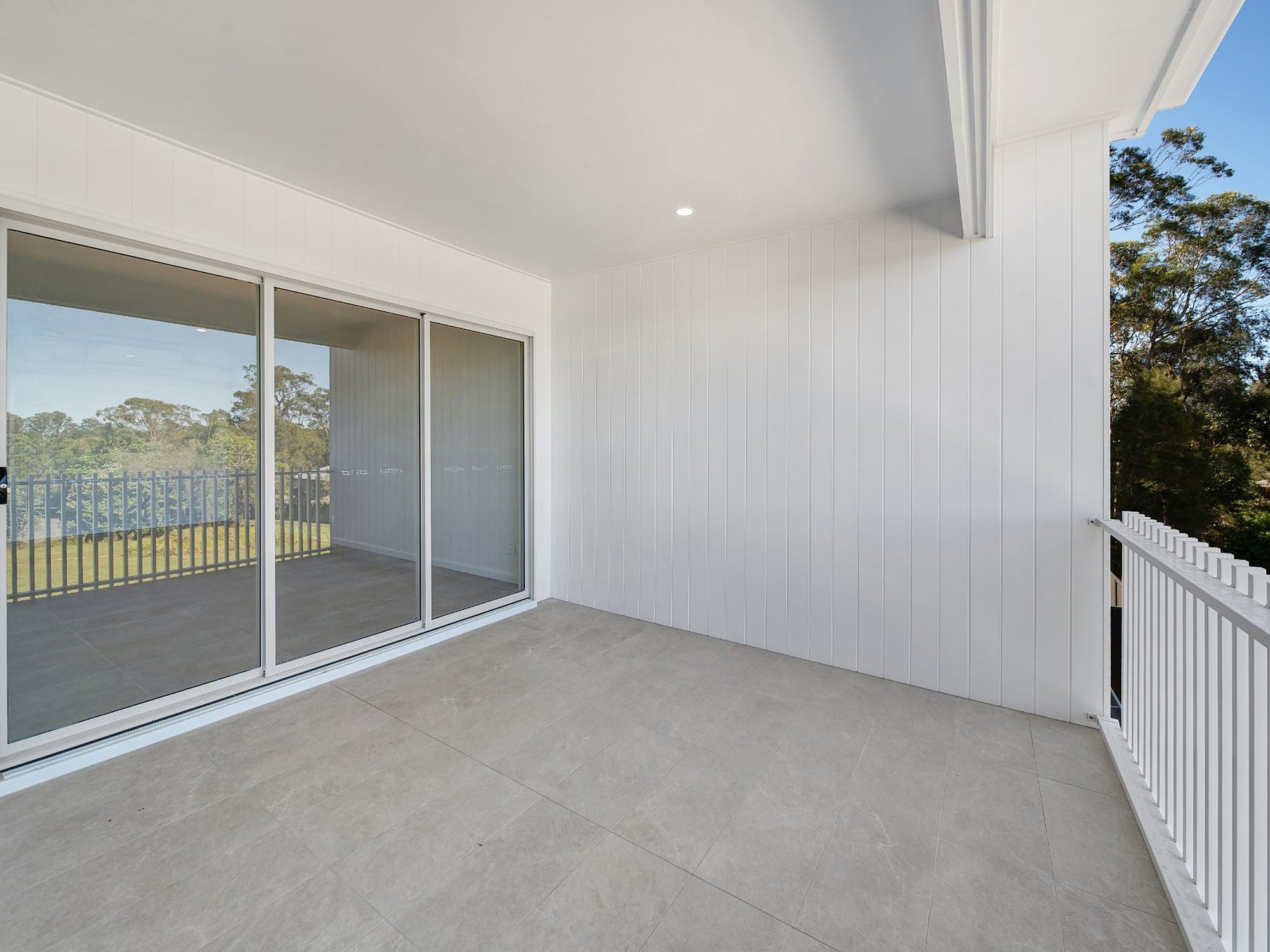 Covered alfresco with sliding doors and bushland views