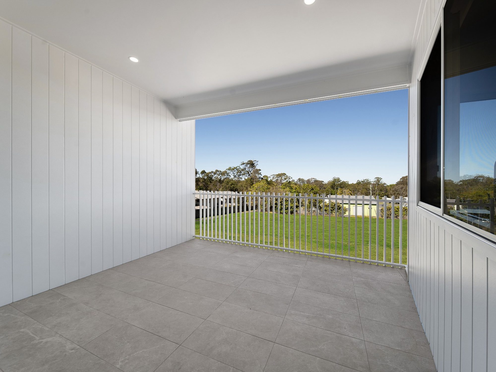 Covered balcony overlooking the communal green space