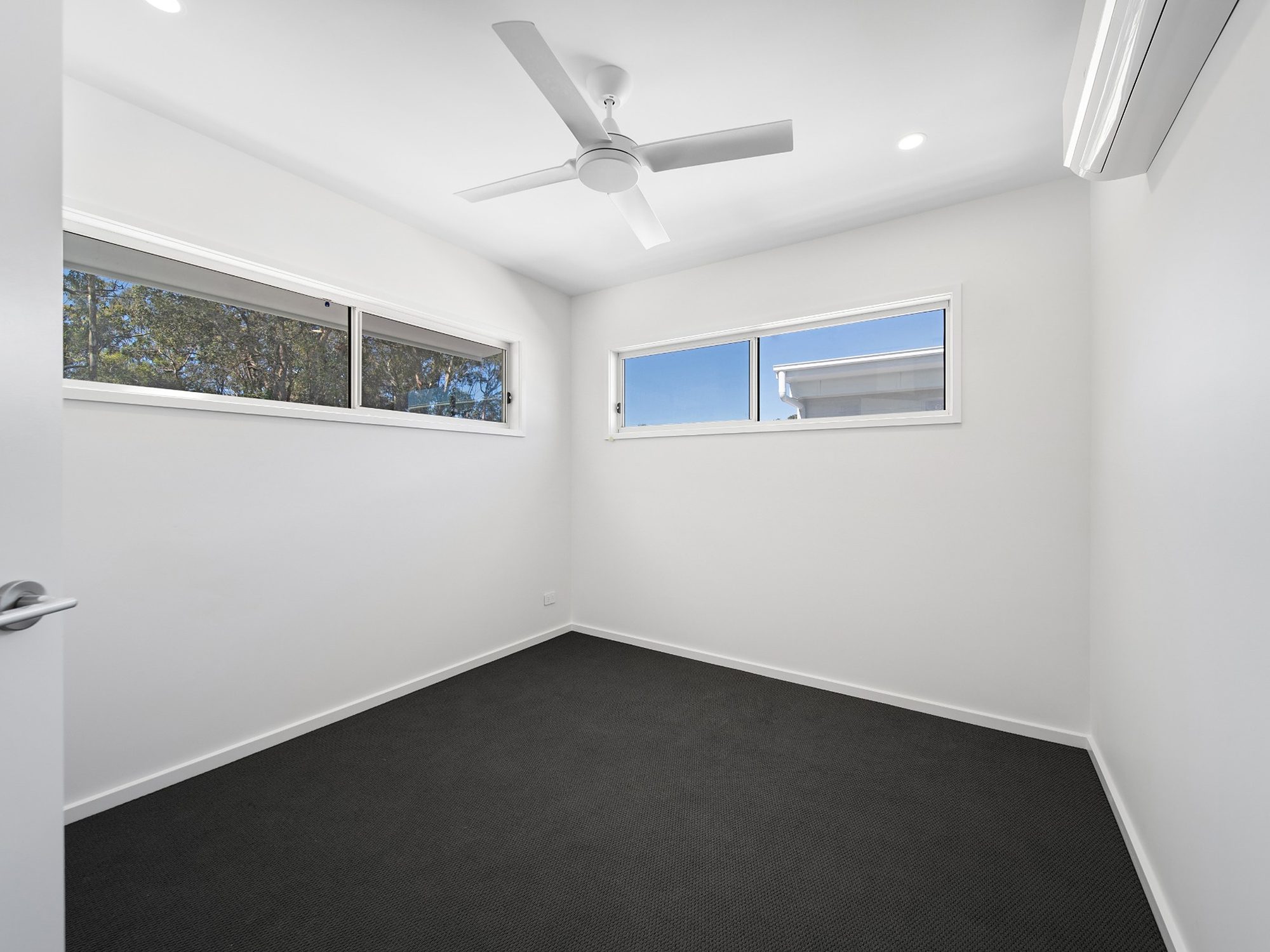 Completed bedroom with carpet and ceiling fan